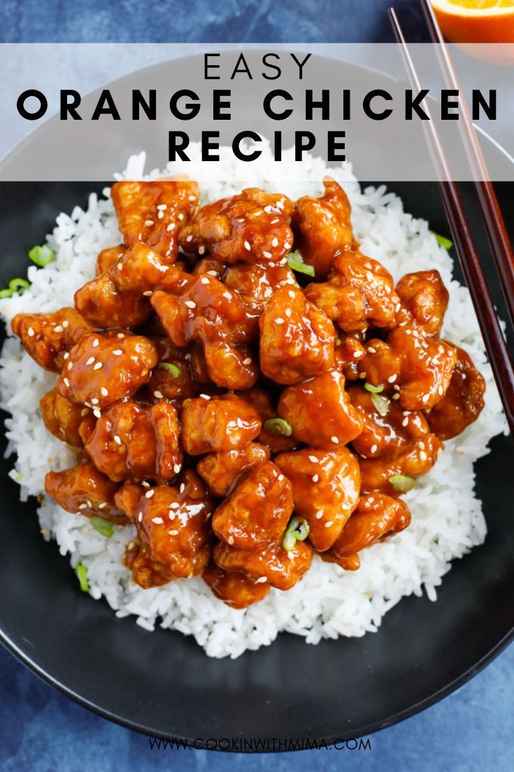 the orange chicken is served over rice with chopsticks and an orange in the background