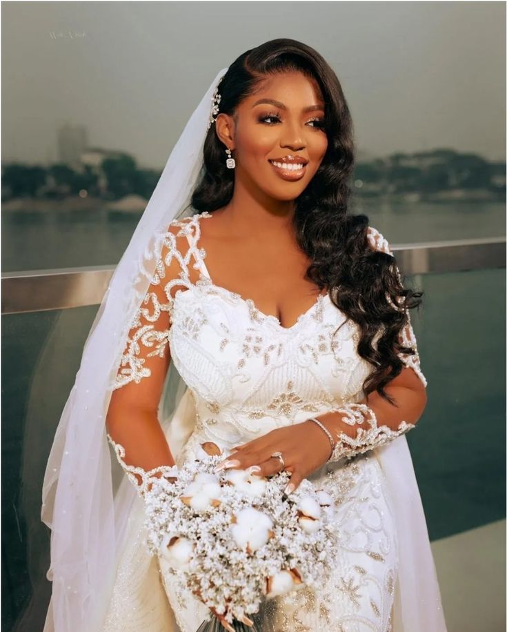 a woman wearing a wedding dress and holding a bouquet