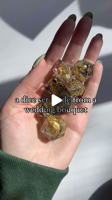 a hand holding some gold nuggets with the words, a piece set off from a wedding bouquet