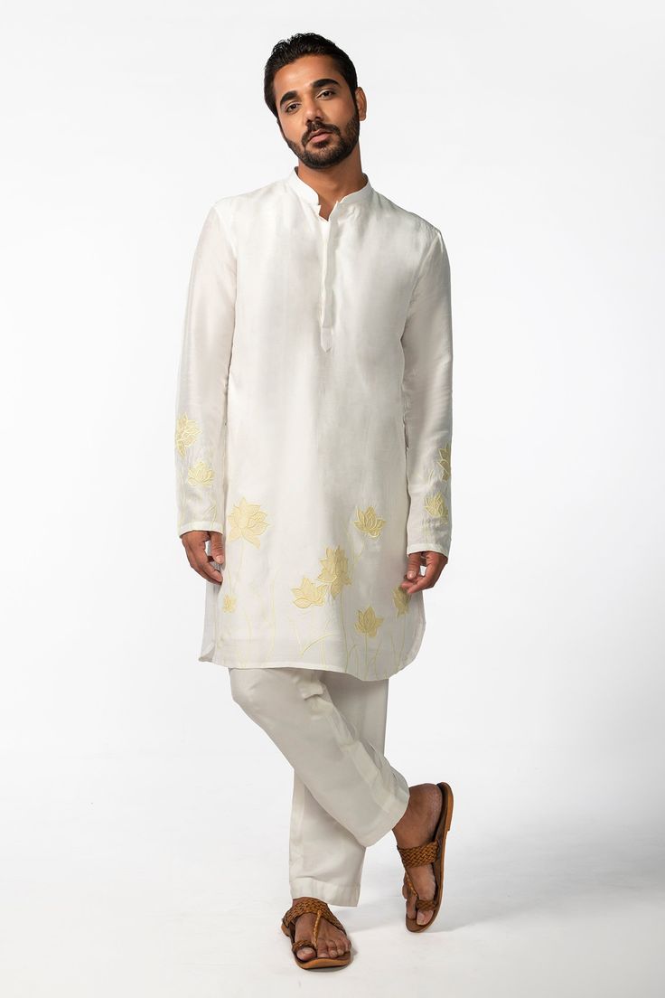 Ivory full sleeve kurta with yellow applique embroidery in geometric pattern and mandarin collared neckline. Paired with pant pyjama.
Components: 2
Pattern: Embroidery
Type Of Work: Applique
Neckline: Mandarin collar
Sleeve Type: Full sleeves
Fabric: Kurta: Bam Silk, Pant Pyjama: Cotton Silk
Color: Ivory
Other Details: 
Front concealed button placket
Occasion: Sangeet - Aza Fashions Applique Kurta, Full Sleeve Kurta, Silk Pant, Pattern Embroidery, Applique Embroidery, Silk Embroidery, Fashion App, Kurta Set, Full Sleeves