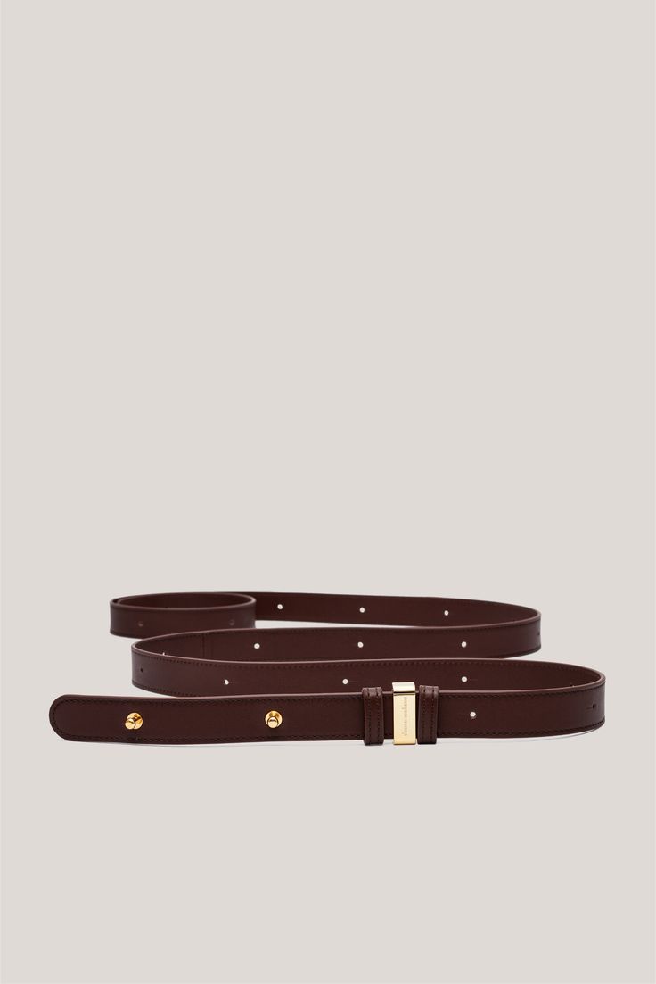 Discover the Double Wrap Belt, a sophisticated accessory designed for both functionality and style. This belt, handcrafted in Italy, embodies luxurious craftsmanship and features a unique gold or palladium belt loop. This one-size-fits-all belt offers a versatile look that can be worn in various ways. Elevate your outfit with this timeless piece that effortlessly combines elegance and practicality. Timeless Formal Belts With Gold-tone Hardware, Timeless Formal Belt With Gold-tone Hardware, Elegant Formal Belt With Gold-tone Hardware, Luxury Gold Belt For Office, Luxury Gold Belt With Self Belt, Luxury Adjustable Belts For Evening, Classic Gold Belt, Luxury Adjustable Evening Belts, Formal Adjustable Belt With Removable Feature