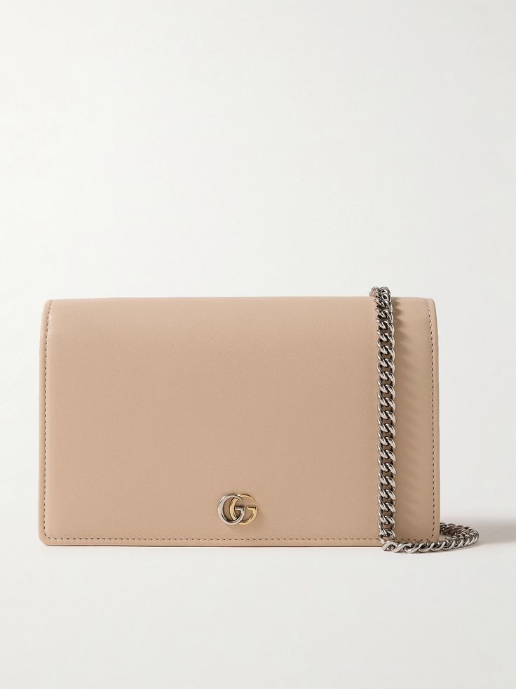 Gucci's wallet is sizable enough to use as a shoulder bag, too - simply attach the silver-tone chain strap and drape it cross-body. It's been made in Italy from sand leather and is punctuated with polished 'GG' hardware at the front. Store your phone, cardholder and lip gloss inside. Timeless Gucci Shoulder Bag For Evening, Gucci Leather Wallet On Chain, Gucci Leather Wallet On Chain For Everyday Use, Gucci Elegant Everyday Shoulder Bag, Elegant Everyday Gucci Shoulder Bag, Gucci Leather Wallet On Chain For Formal Use, Gucci Leather Wallet On Chain For Formal Occasions, Classic Gucci Wallet On Chain, Designer Gucci Leather Wallet On Chain