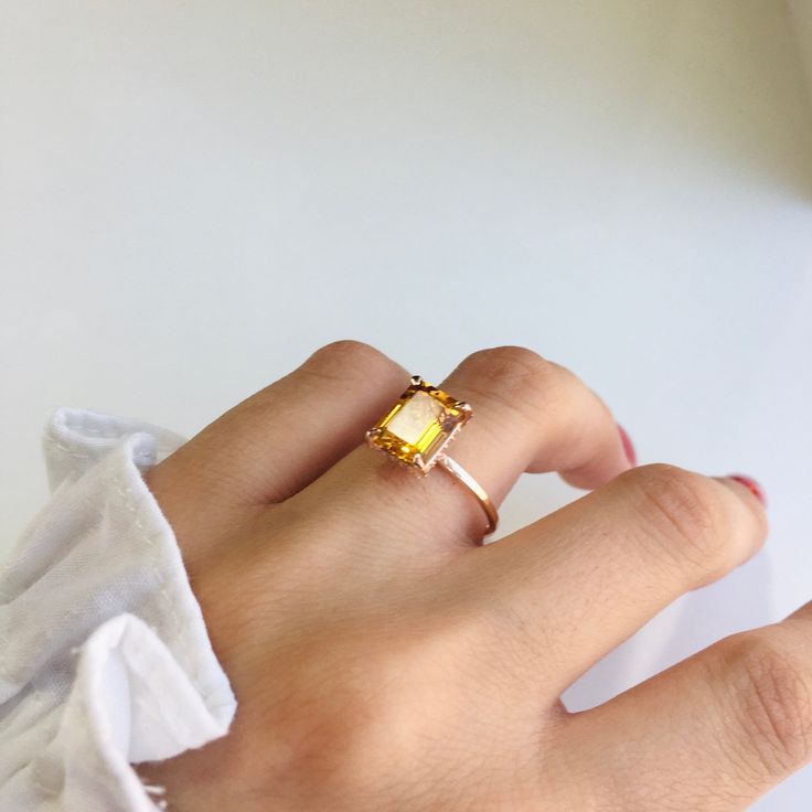 RING DETAILS: ✪Design: Gold ring ✪Gemstone: Natural yellow beryl, moissanite diamond ✪Gemstone shape: Emerald cut ✪Gemstone transparency: Transparent ✪Gemstone weight: Natural yellow beryl- 2.40 cts. ✪Setting type: Prong setting ✪Metal type: 14k solid gold ✪Gold weight: 1.81 gm ✪Metal finish: Smooth shiny ✪Total ring weight: 2.23 gm Choose your ring size from drop down menu and if you need any other preferred ring size please contact us. QUALITY OF MATERIALS: Metal: Most of our jewelry at Jewelr Citrine Promise Ring With Prong Setting, Citrine Prong Setting Promise Ring, Yellow Open Ring Promise Ring, Fine Jewelry Citrine Open Ring, Yellow Open Ring For Promise, Emerald Cut Citrine Rings, Yellow Open Promise Ring, Diamond Cut Citrine Rings For Gift, Citrine Diamond Cut Ring Gift