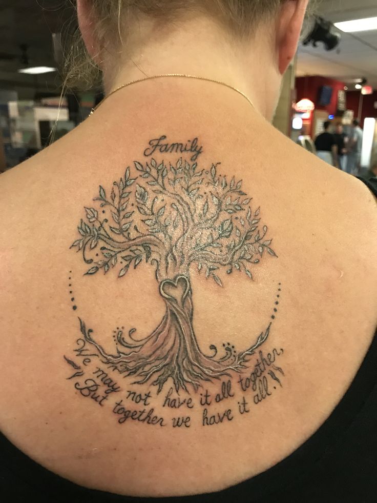 a woman with a tree tattoo on her back