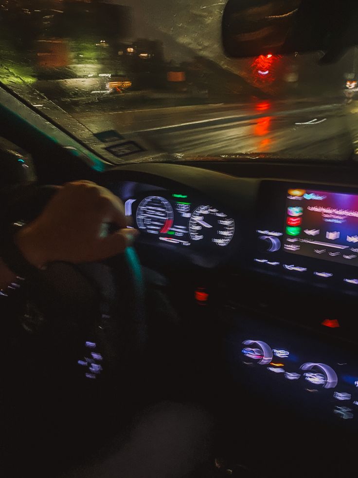 the dashboard of a car at night time