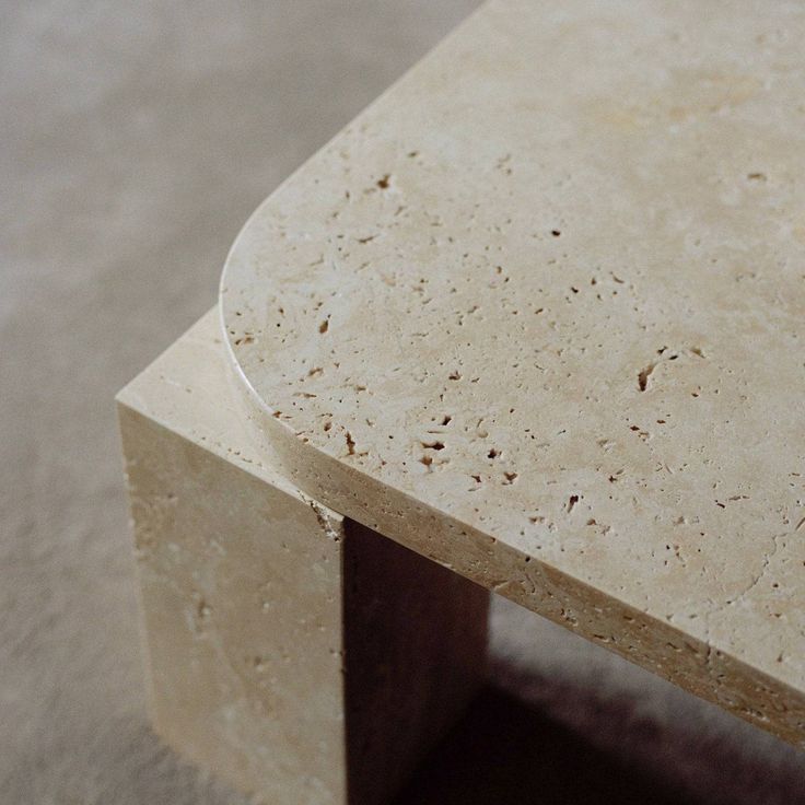 a close up of a marble table on the floor with no one around it or someone else