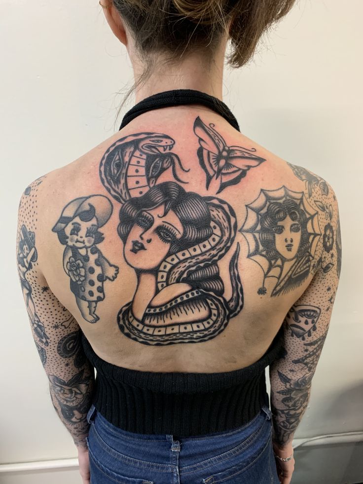 a woman with tattoos on her back