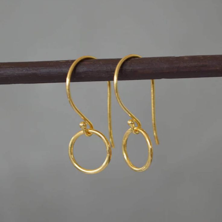 "Beautiful minimalist 24k gold vermeil circle earrings. Vermeil is a thick coat of 18 or 24 karat gold on solid sterling silver. These earrings would make a perfect gift for any occasion. Total length: 2.5 cm (0.9\") Circle diameter: 1 cm (0.3\") They will come in a beautiful gift box. Matching necklace available: www.etsy.com/uk/listing/834068362/minimalist-24k-gold-vermeil-circle?ref=shop_home_active_13&pro=1&frs=1  * CHECK OUT MORE JEWELLERY *   www.etsy.com/shop/kailajewellery" Simple Gold Round Earrings, Gold Minimalist Round Pendant Earrings, Dainty Yellow Gold Circular Earrings, Gold Circle Earrings In Sterling Silver, Gold Sterling Silver Circle Earrings, Gold Minimalist Open Circle Earrings, Minimalist Gold Open Circle Earrings, Everyday Gold Open Circle Earrings, Minimalist Gold-plated Circle Earrings