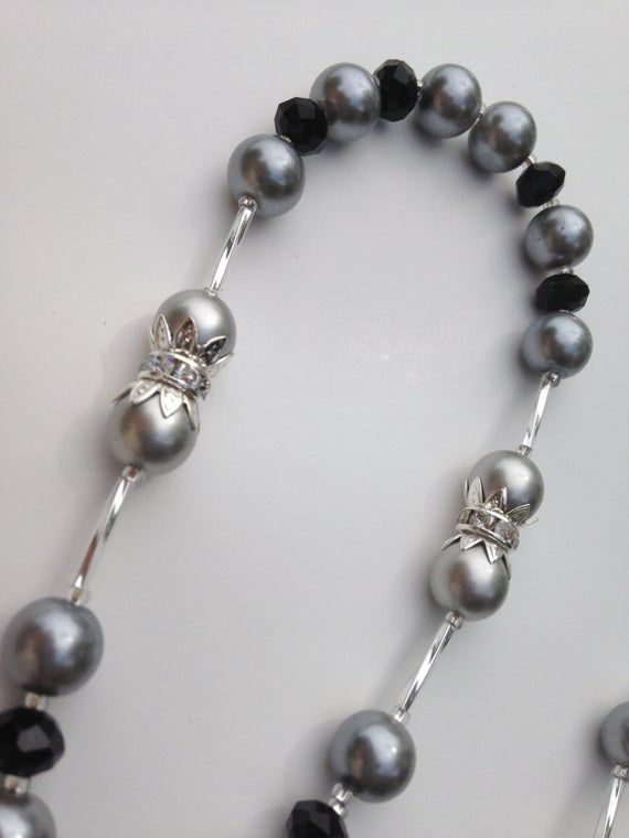 Black and silver Pearls Rosary/ Perlas silver con crystal negro/ Raider Fan Rosary Silver Pearl Jewelry With Rhinestones, Silver Round Beads Jewelry For Party, Elegant Adjustable Gray Jewelry, Silver Metal Jewelry With 8mm Beads, Elegant Gray Metal Jewelry, Elegant Silver Necklace With 8mm Beads, Classic Silver Beaded Jewelry, Elegant Party Necklace With 8mm Beads, Party Silver Jewelry With Polished Beads