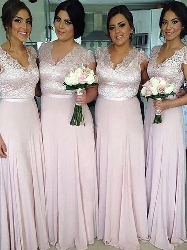 the bridesmaids are all wearing pink dresses and holding bouquets in their hands