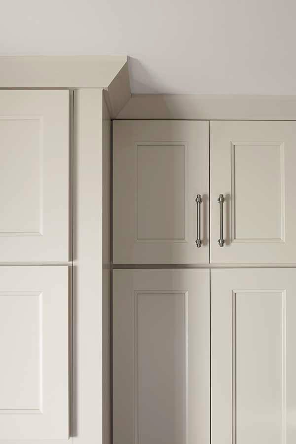 white cabinets with doors and drawers in a room