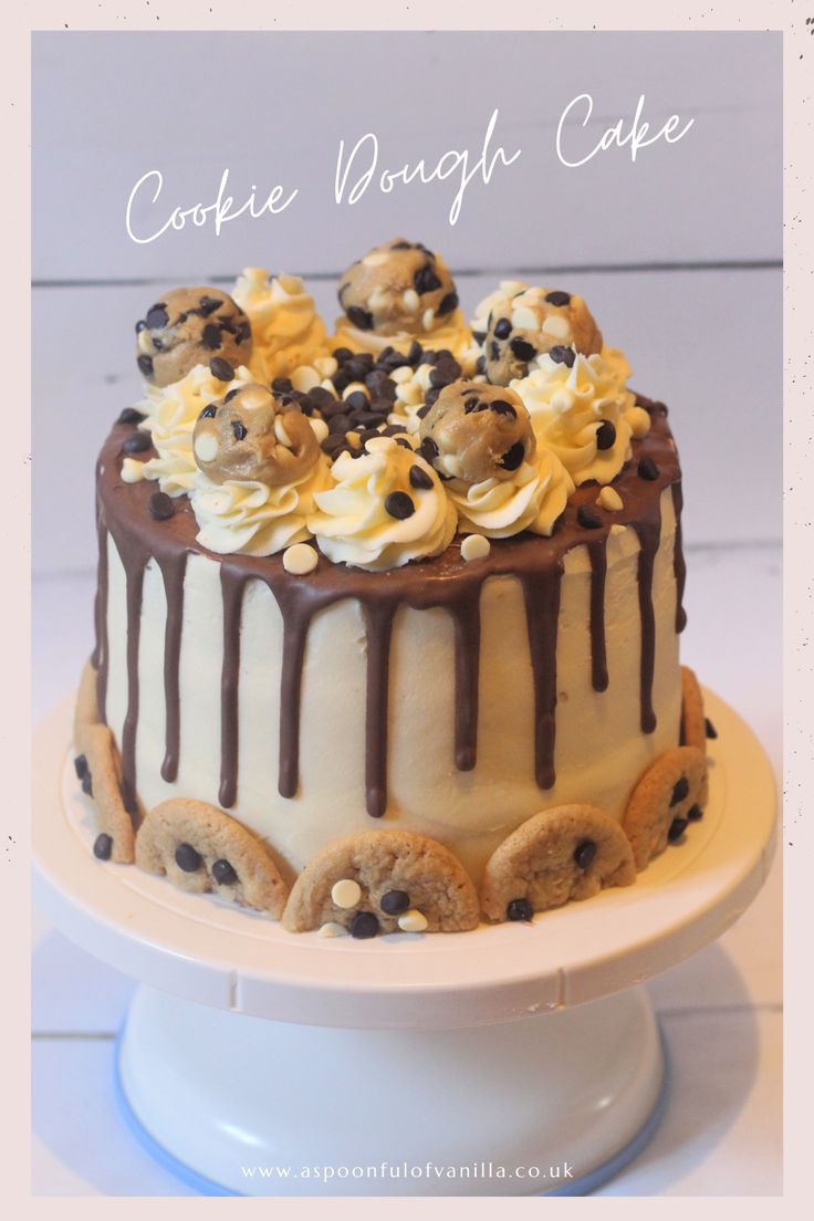 a cake with cookies and marshmallows is on a white plate that says cookie doughnut cake