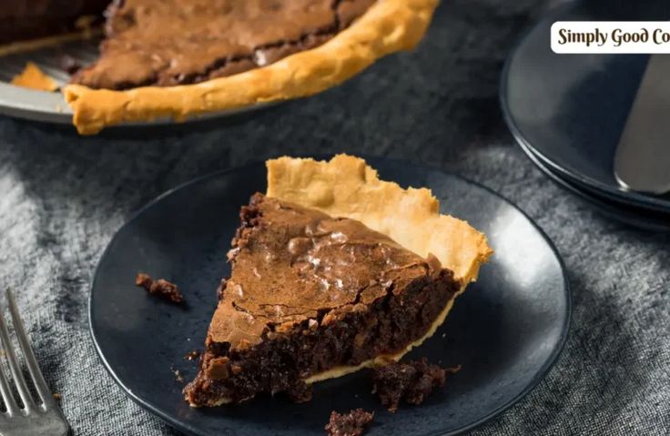 there is a piece of chocolate pie on the plate