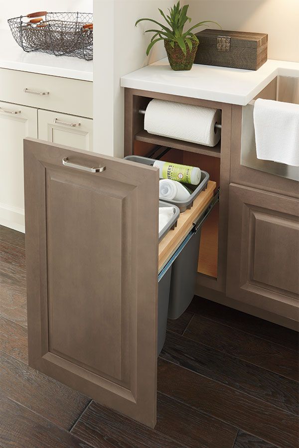 an open cabinet door in a kitchen