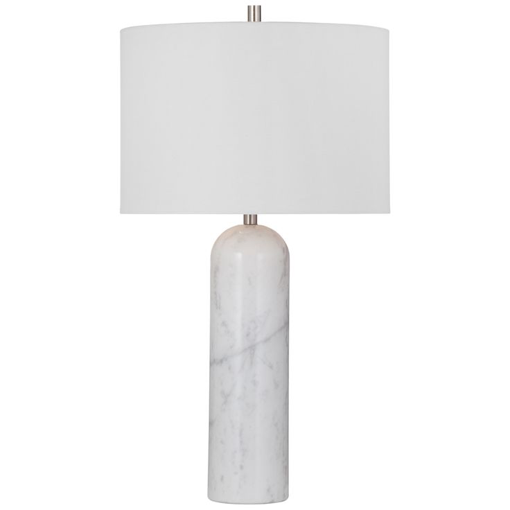 a marble lamp with a white shade on it