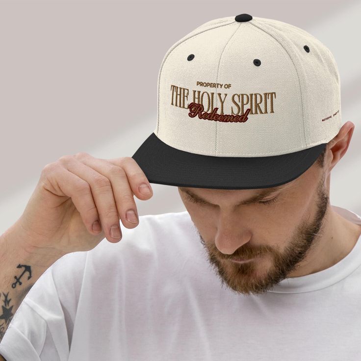 🔥🔥 IMPORTANT NOTICE: In case you come across this design elsewhere, please be aware that it has been taken without authorization from our store. This design has been created by me.🔥🔥 Enjoy this custom Modern Christian cap that features "Property of The Holy Spirit/Redeemed" in a puffed embodied gold and marron text pattern. This hat is a great Christmas stocking stuffer, trendy birthday for gift her or add to a special touch to his collection. Spread Gods message with this snapback THIS HAT COMES IN: Natural/Black, Full Black, Blue/Red, Deep Green,  80% acrylic, 20% wool Structured, 6-panel, high-profile 6 embroidered eyelets Plastic snap closure Green undervisor Head circumference: 21⅝″-23⅝″ (54.9 cm-60 cm) [PROCESSING & SHIPPING]  I OFFER FREE SHIPPING ON MOST PRODUCTS IN MY STORE. T Christian Hats For Men, Faith Hats, Embroidery Christian, Church Merch, Gods Message, Christian Tee Shirts, Text Pattern, Christian Hats, Birthday Gifts For Men