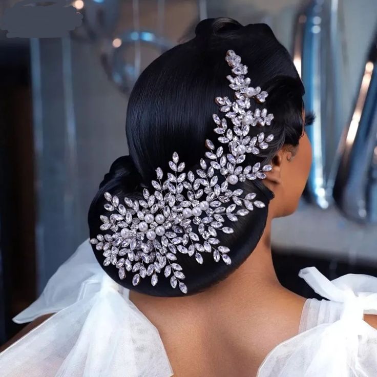 the back of a woman's head wearing a bridal hair piece