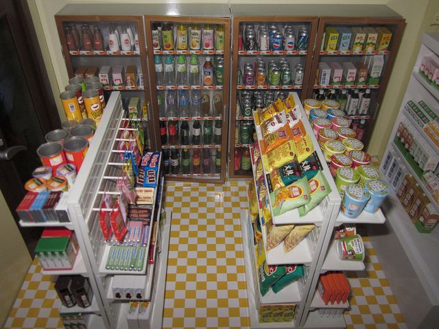 an overhead view of a grocery store with many items on the shelves and in the refrigerator