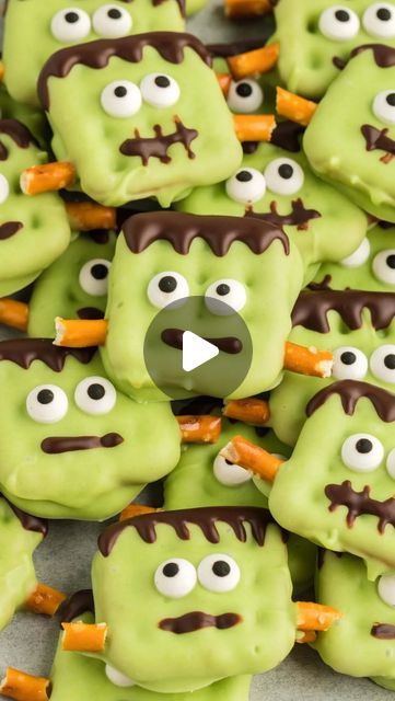 some green cookies with googly eyes and carrots on them are arranged in the shape of monsters