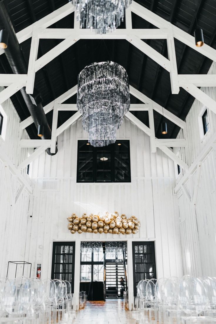 the inside of a building with chandeliers hanging from the ceiling