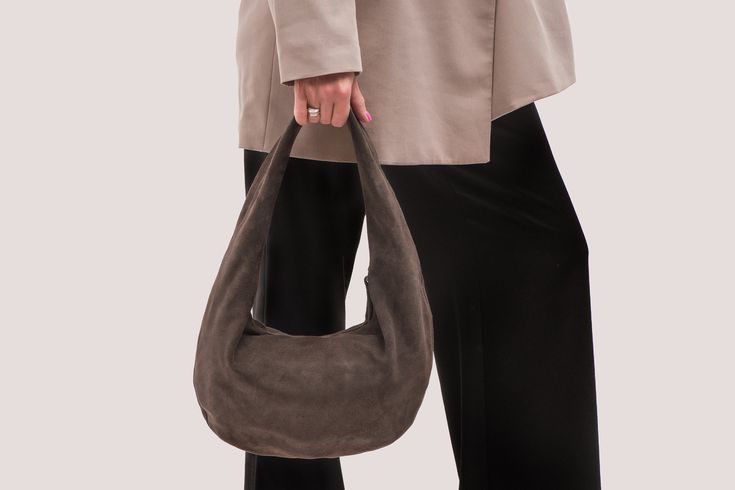 Brown Suede Hobo Bag - The Perfect Blend of Style and Comfort Elevate your fashion game with our exquisite Brown Suede Hobo Bag. Crafted from high-quality suede, this Soft Leather Bag combines luxury with functionality, making it an ideal addition to any wardrobe. Product Features: Suede Hobo Bag: Made from premium suede, this bag offers a soft, velvety texture that's both stylish and durable. Rounded Design Bag: The unique rounded shape adds a contemporary touch to a classic silhouette, making Suede Hobo Bag, Suede Tote Bag, Suede Purse, Soft Leather Bag, Design Bag, Suede Tote, Suede Handbags, Hobo Style, Brown Leather Bag