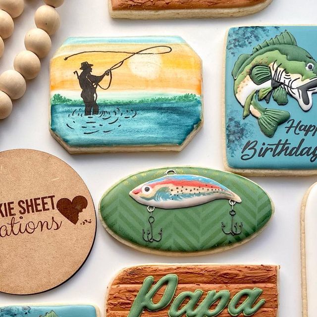 decorated cookies with fishing images and words on them