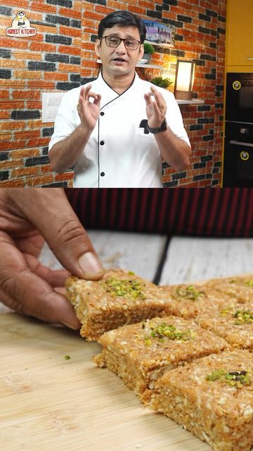 a person holding food in front of a tv with the image of a chef on it