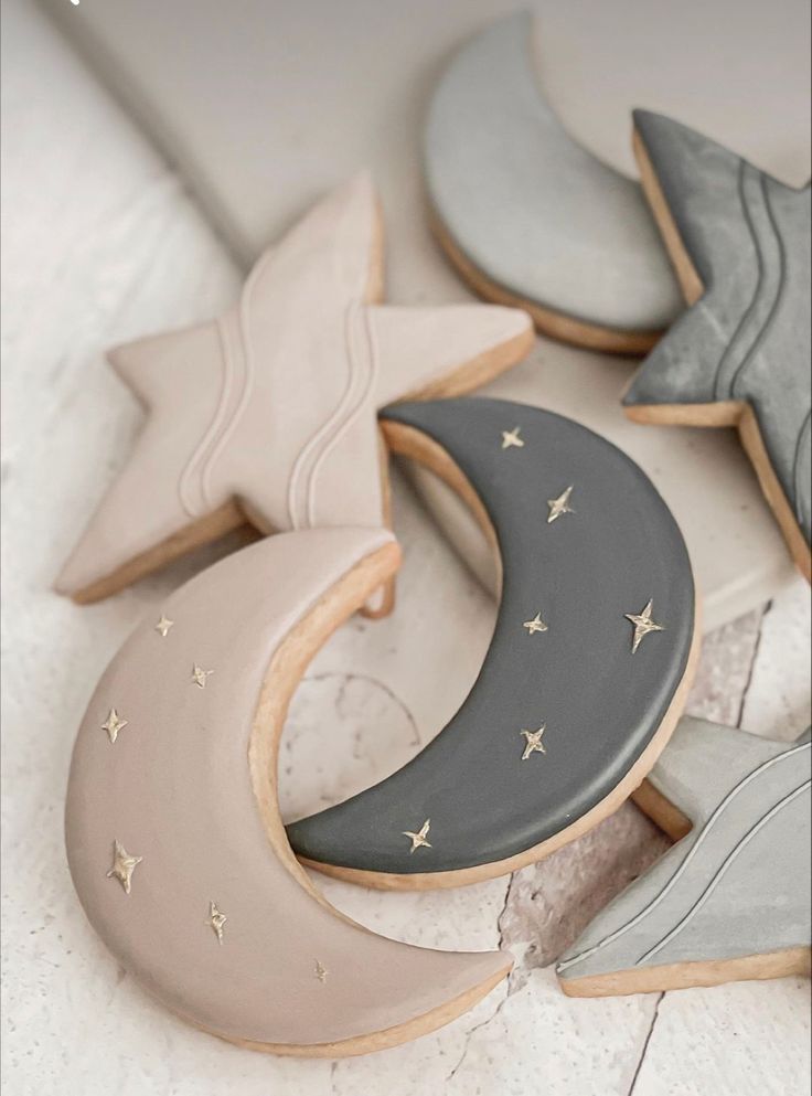 decorated cookies in the shape of crescents and stars