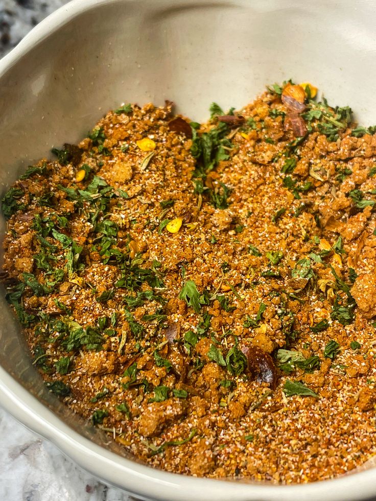 a bowl filled with food sitting on top of a counter