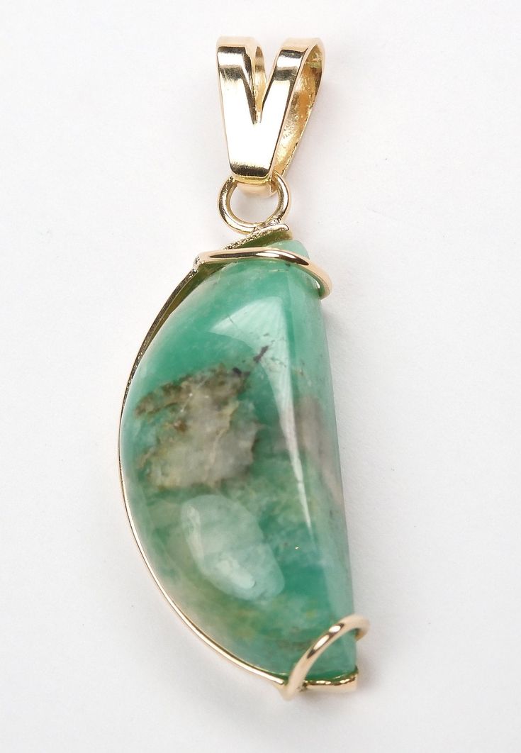 Colombian Carved Emerald Pendant Set in 14K Yellow Gold 1 Natural Fancy Shape Emerald / Size ~ 17.00 Carats Color ~ Medium-Green / Clarity ~ Type 3 Metal ~ 14K Yellow Solid Gold / Weight ~ 5.10 Grams Unique ~ Gorgeous  Half Moon ~ Distinctive & Rare MEASUREMENTS North to South Including Bail ~  39.90 mm (1.570 Inches ) East to West at widest section ~ 13.18 mm (0.518 Inches) East to West at Bail Section ~ 6.05 mm (0.238 Inches) Maximum Chain size ~ 4.00 mm (0.157 Inches) Gold chain not included Estimated Retail Replacement Value $2,400.00 All Jewelry purchased is certified by a GIA Gemologist Emeralds....one of the extraordinary and most beautiful gemstones found in nature! {We Can Offer You A Lay-A-Way Plan. Please Inquire} PayPal has a program called "Bill me later". Up to 6 months inter Crescent Shaped Fine Jewelry For Formal Occasions, Formal Crescent Fine Jewelry, Yellow Gold Chrysoprase Jewelry For May Birthstone, Fine Jewelry Chrysoprase For Formal Occasions, Anniversary Yellow Gold Chrysoprase Jewelry, Chrysoprase Jewelry For Anniversary And May Birthstone, Chrysoprase Gemstone Jewelry For Anniversary, Formal Fine Jewelry With Chrysoprase, 14k Gold Jewelry With Cabochon For May Birthstone