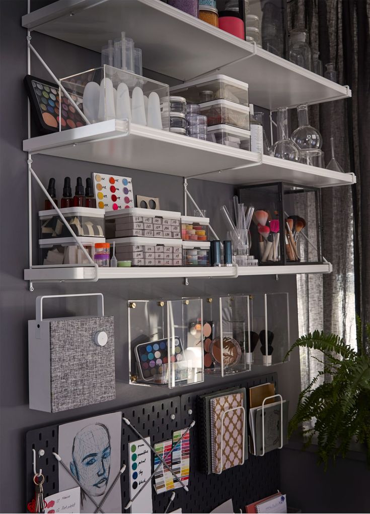 the shelves are filled with craft supplies and other things to make it look like shelving