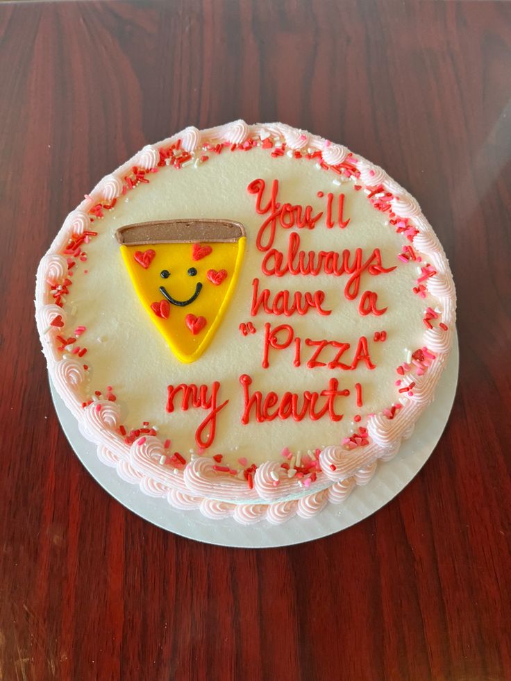 a birthday cake with a slice of pizza on it that says you'll always have a pizza my heart