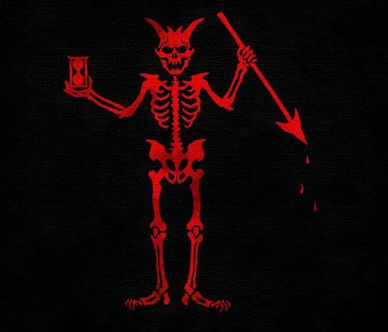 a red skeleton holding a lit candle in its right hand and pointing to the left