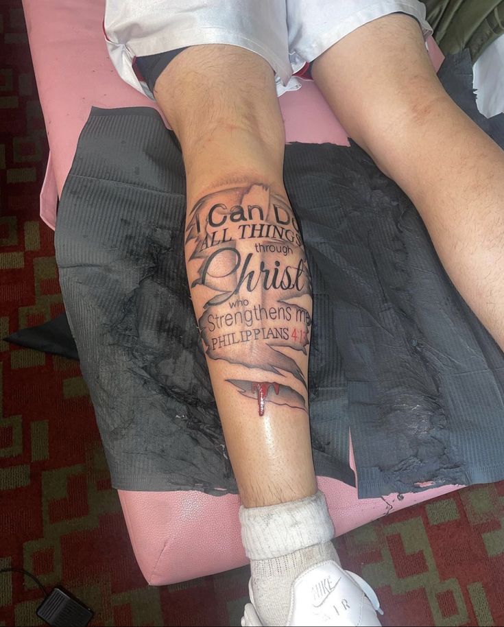 a person with a tattoo on their leg