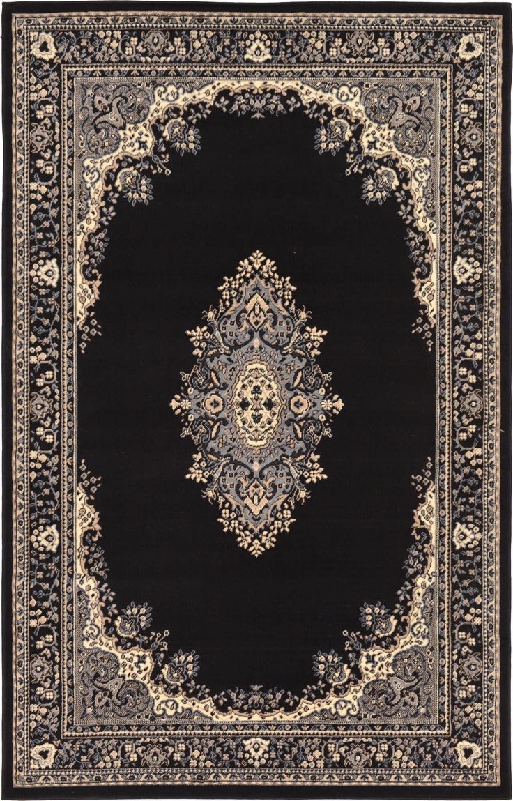 a black rug with an ornate design on it