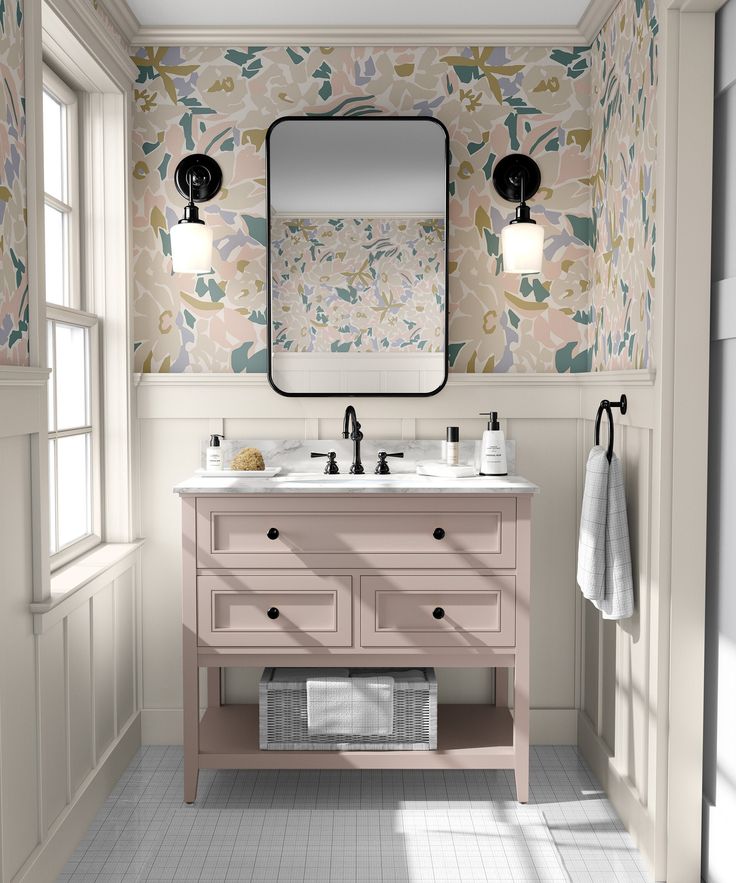 a bathroom with two sinks and a large mirror above the sink is decorated in floral wallpaper