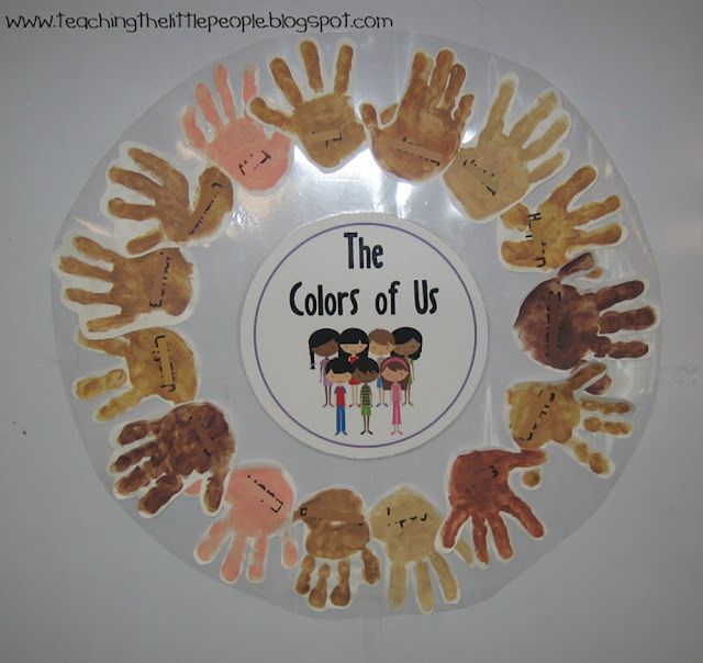 the colors of us handprinted on a plate with children's hands in it