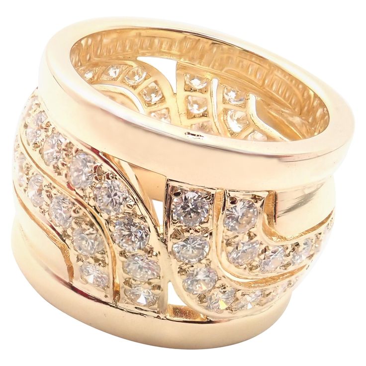 18k Yellow Gold Diamond Wide Band Ring by Cartier. With 64 round brilliant cut diamonds VVS1 clarity, F-H color total weight approximately 2.56ct Details: Ring Size: European 51, US 5.75 Band Width: 14mm Weight: 12.9 grams Stamped Hallmarks: Cartier 750 51 62XXXX(serial number omitted) *Free Shipping within the United States* YOUR PRICE: $9,950 T2886eodd Wide Band Diamond Rings, Cartier Love Ring, King King, Vintage Designer Jewelry, King Edward, Wide Band Ring, Royal Court, Cartier Love, Gold Band Ring