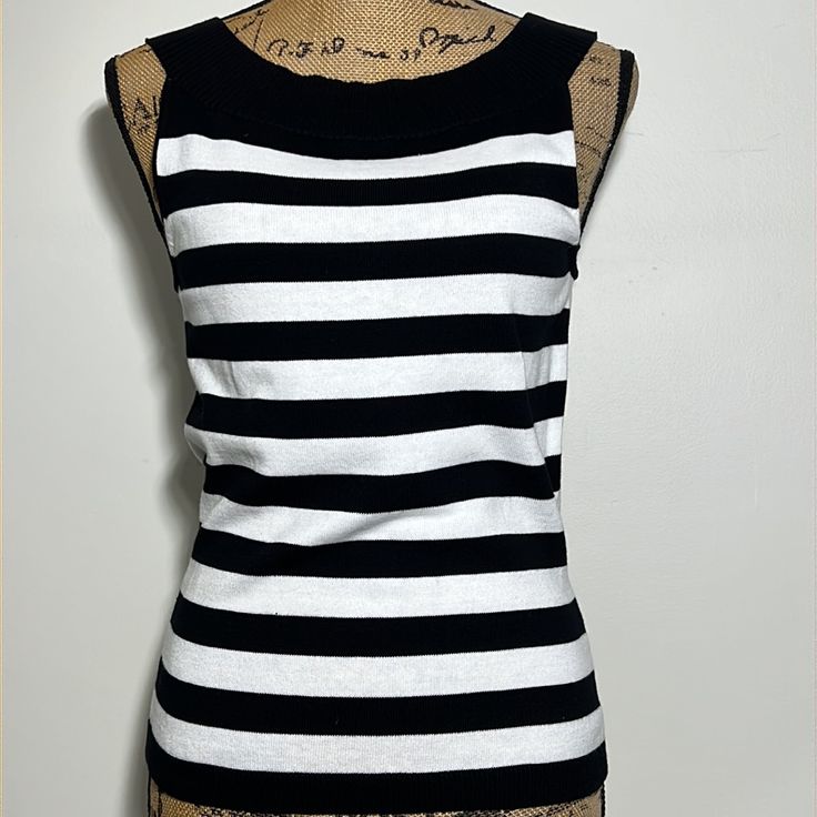 Horizontal Stripe Black And White Sleeveless Top. 15.5” Pit-Pit, 23.9” Length. Ribbed Knit Striped Knit Sleeveless Tank Top, Casual Striped Fitted Sweater Vest, Fitted Striped Sweater Vest Casual, Fitted Striped Sleeveless Tank Top, Chic Striped Fitted Tank Top, Fitted Striped Knit Tank Top, Summer Sleeveless Black And White Tops, Black And White Sleeveless Top For Summer, Black And White Sleeveless Summer Tops