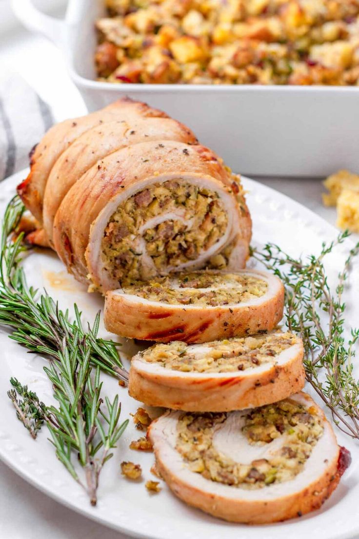 sliced meatloaf with stuffing on a white plate