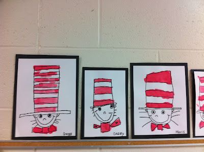 three dr seuss cat in the hat pictures hanging on a wall