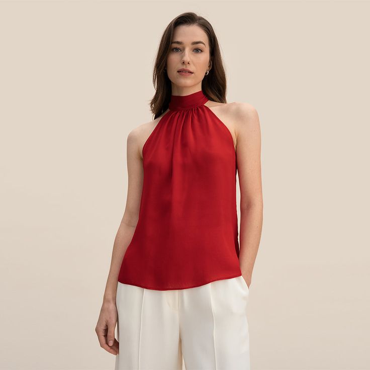 Step into the season with sophistication in our Women's Silk Halter Tank Top. Designed with a lightweight and soft 10 Momme Georgette silk, this top offers a smooth and elegant appeal that drapes beautifully for a flattering fit. The halter neckline and charming bow-tie decoration add a touch of femininity and class to your wardrobe, making it a must-have for any fashion-conscious woman. Key Features Fabric Type: Luxurious satin-finish silk Design: Halter neck with adjustable bow-tie Fit: Relaxed and comfortable fit Pattern: Solid for easy pairing Elasticity: Non-stretch for a structured look Seasonality: Perfect for Spring and Summer wear Product Benefits Embrace the perfect blend of style and comfort with our Silk Halter Tank Top. Here's why you'll love this top: Timeless Elegance: The s Halter Tank Top, Halter Tank, Silk Tank Top, Halter Tops, Halter Neck Top, Silk Tank, Summer Party, Summer Wear, Halter Neck