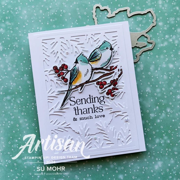 a card with two birds sitting on a tree branch, and the words sending thanks