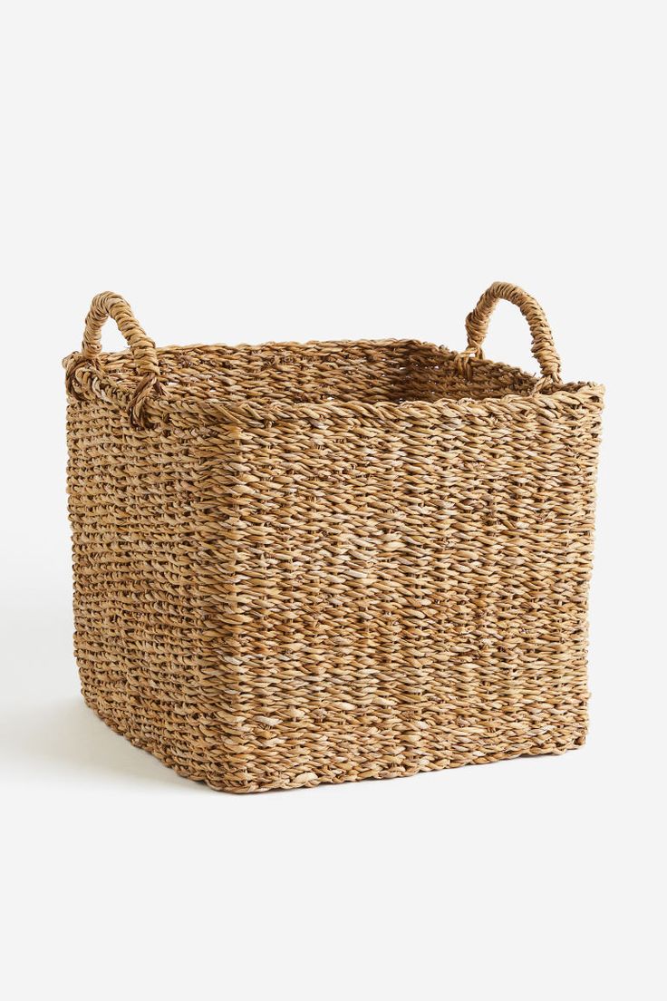 a large woven basket with handles