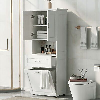 a white toilet sitting in a bathroom next to a tall cabinet with towels on it