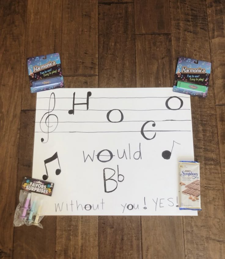 a sign that has been placed on the floor with music notes and other items around it