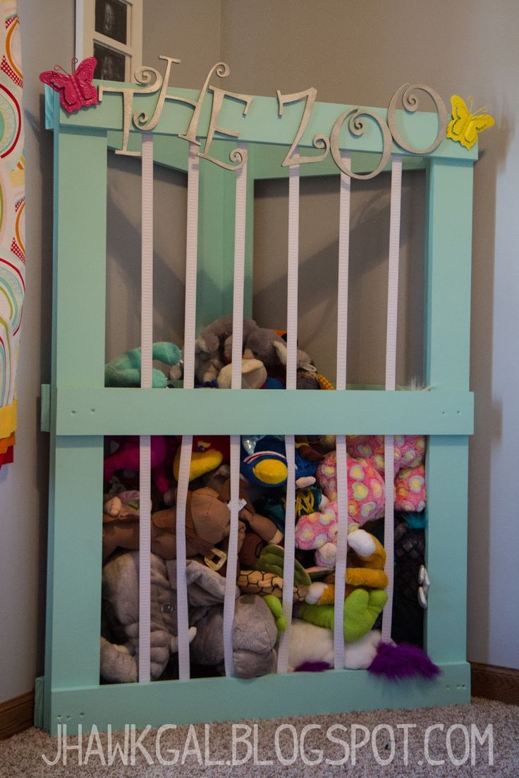 a stuffed animal cage filled with lots of stuffed animals