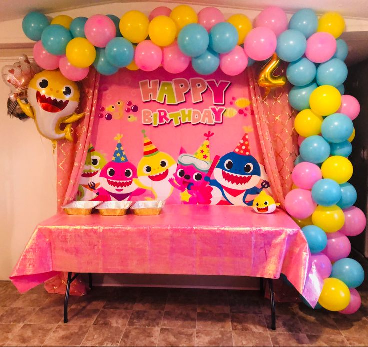 a birthday party with balloons and decorations