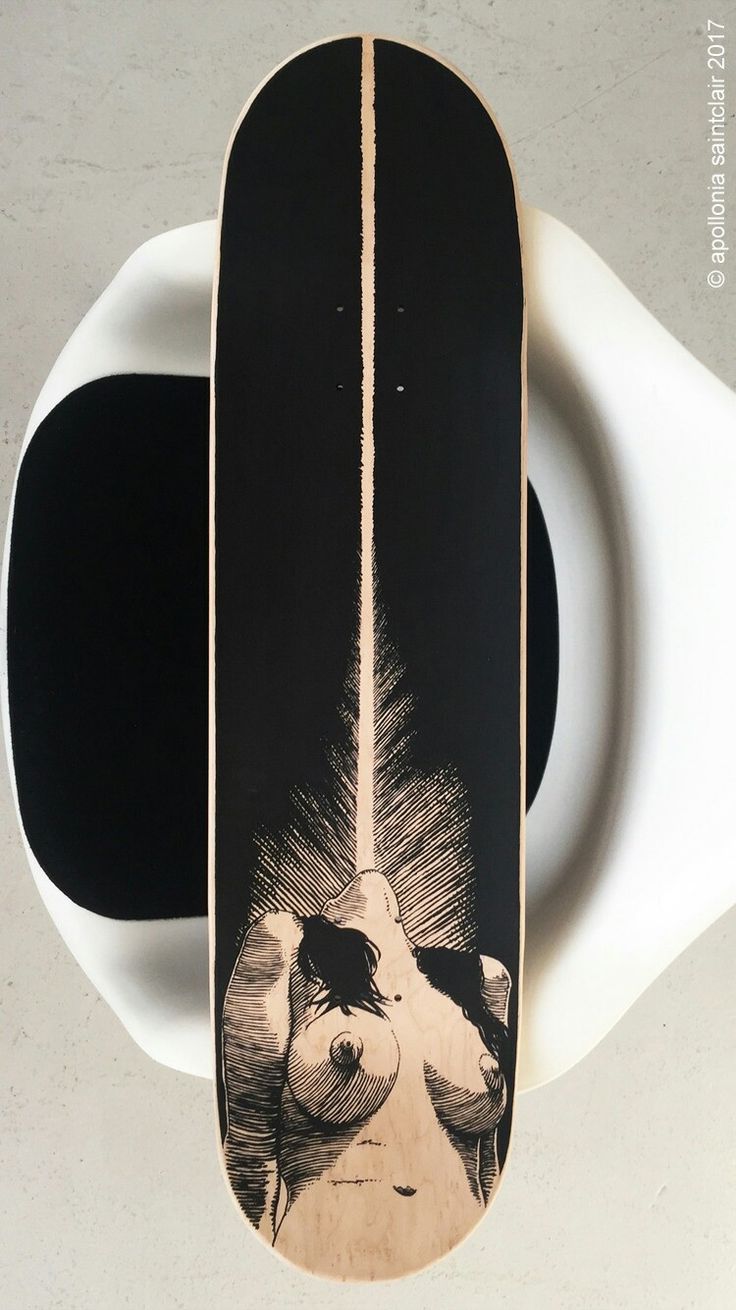 a skateboard that is on top of a white object with a black and white background