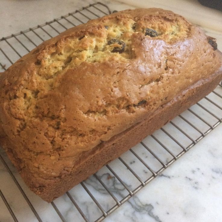 a loaf of bread sitting on top of a cooling rack